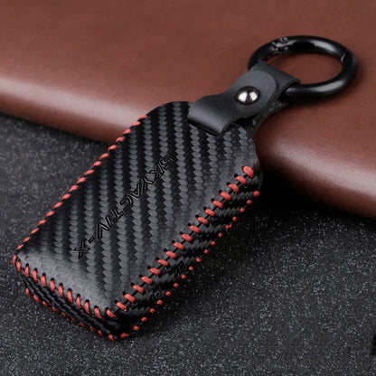 Black leather car key case with button closure and keyring hole