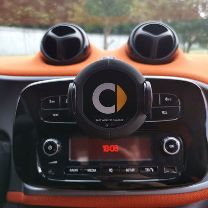 Car wireless charger mounted on a vehicle dashboard, featuring a compact charging cradle for smartphones