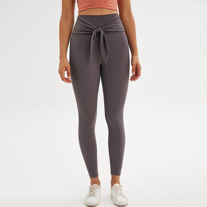 Nine-point legging yoga pants with straps in a sleek, supportive design
