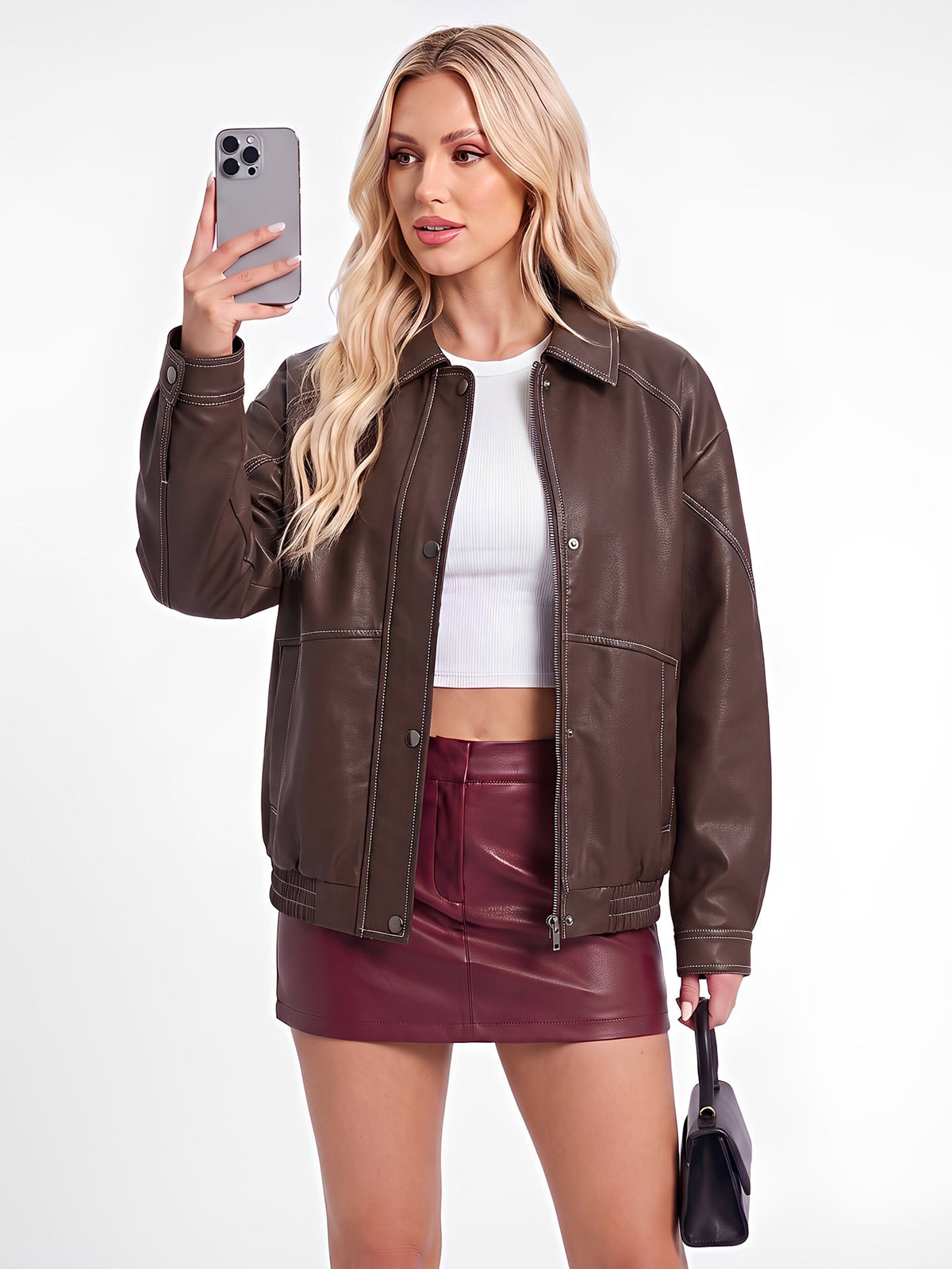 Women's black imitation leather oversize motorcycle jacket with zipper front and long sleeves