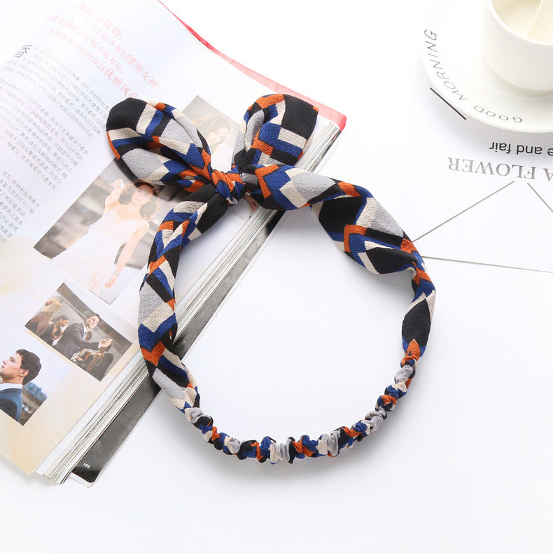 Big bow tie bunny ears headband with playful rabbit ears design