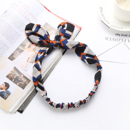 Big bow tie bunny ears headband with playful rabbit ears design