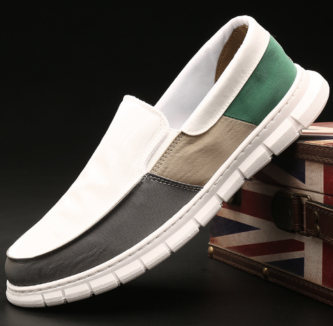 Men's color block slip-on canvas sneakers by BACKUPMYFILESNOW® with vibrant blue, red, and white panels on a casual style shoe.