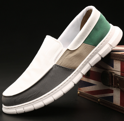 Men's color block slip-on canvas sneakers by BACKUPMYFILESNOW® with vibrant blue, red, and white panels on a casual style shoe.