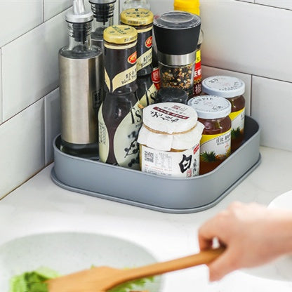 Multifunctional rotating shelving condiment storage box with carousel design for organized kitchen storage