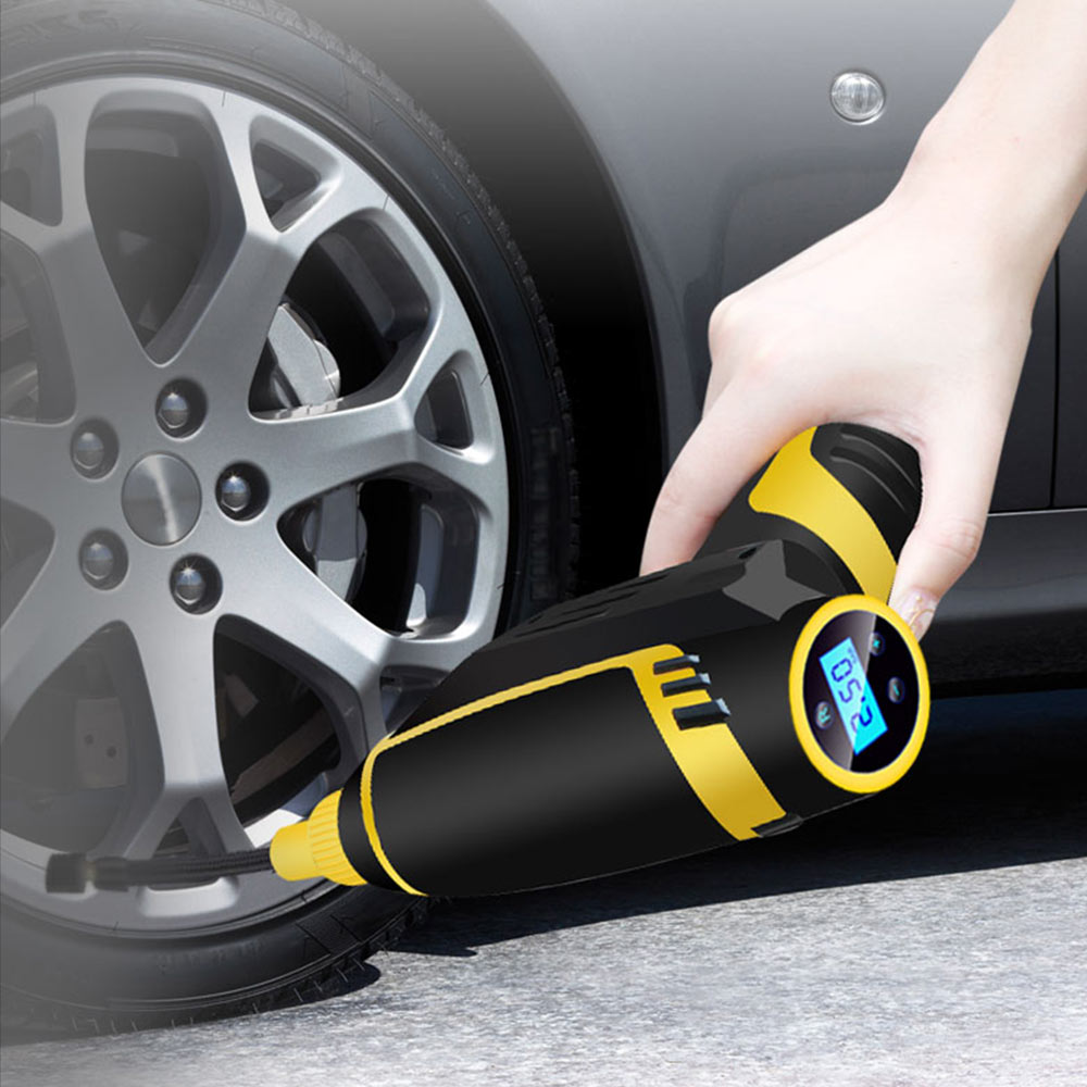 Portable car tire inflation pump with digital pressure gauge and air hose, shown in black and compact design