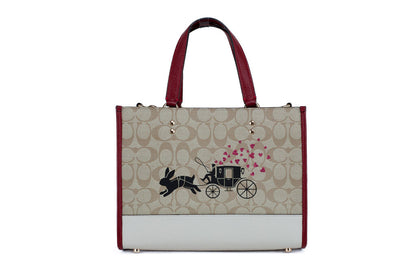 Coach Dempsey Medium Lunar New Year Rabbit Carryall Tote by BACKUPMYFILESNOW® with detailed rabbit embroidery and structured leather handles.