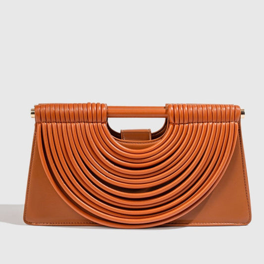 Handcrafted knotted woven noodle-shaped tote bag in textured woven material