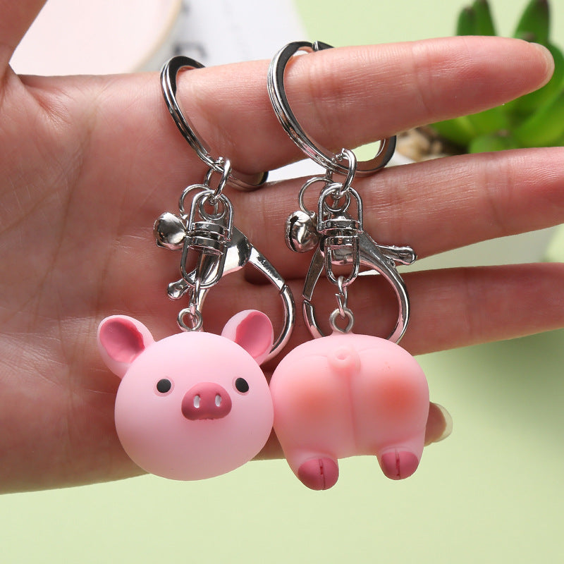 Cute creative key ring doll ornament, colorful miniature character accessory displayed on a light background