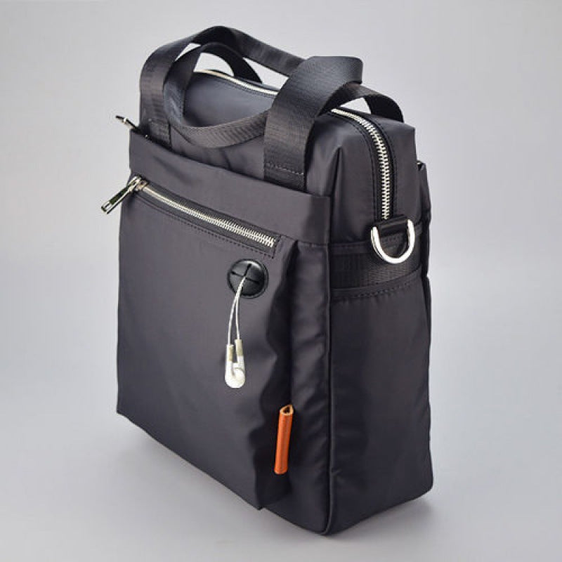 Oxford-style vertical casual crossbody bag, compact rectangular design with adjustable shoulder strap