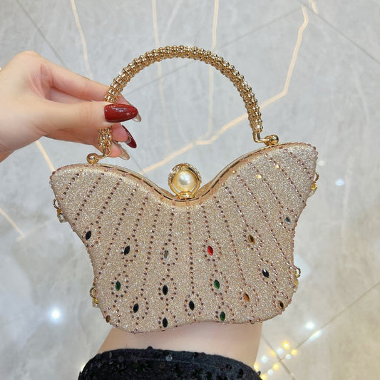 Butterfly-shaped crossbody and shoulder handbag in a sleek, decorative design
