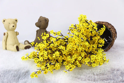 Artificial flower in realistic bloom, decorative faux floral stem displayed against a clean background