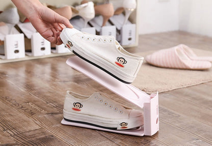 Shoe storage rack with multiple shelves for organizing footwear