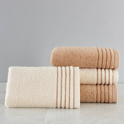 Cotton towel set in assorted colors and folded stack arrangement
