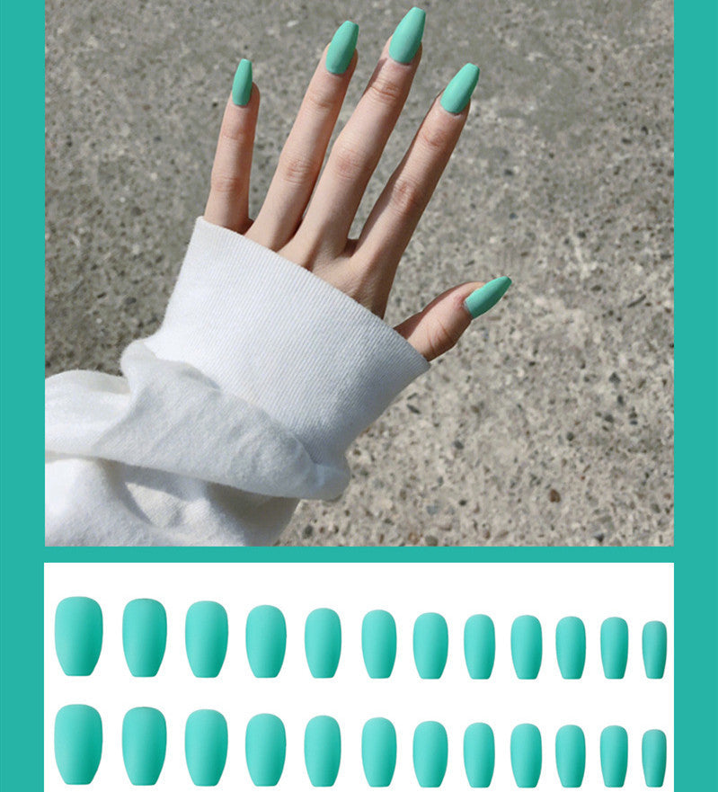 Frosted ballet fake nails, close-up of pale ballet-inspired artificial nail tips