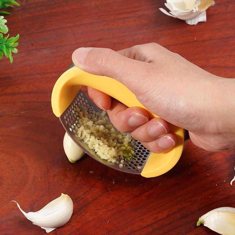 Stainless steel manual garlic press and masher with curved handle for kitchen use