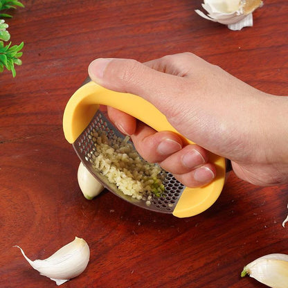 Stainless steel manual garlic press and masher with curved handle for kitchen use
