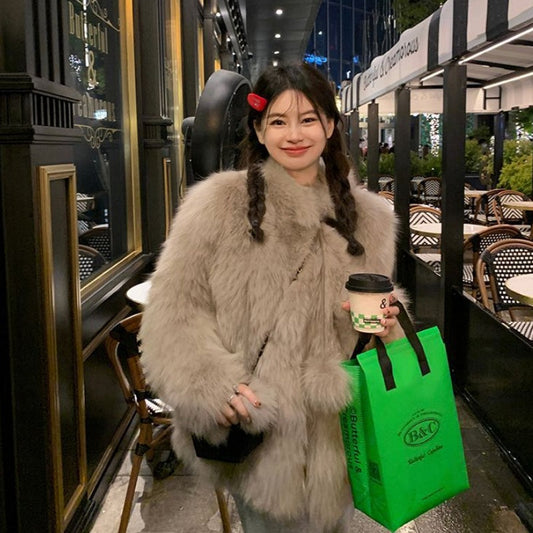 Young women’s fashion fur slimming coat, front view, soft textured fur and fitted silhouette