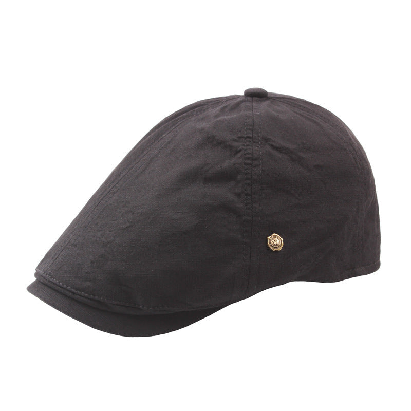 Plaid men's flat cap retro beret with copper button detail, close-up view