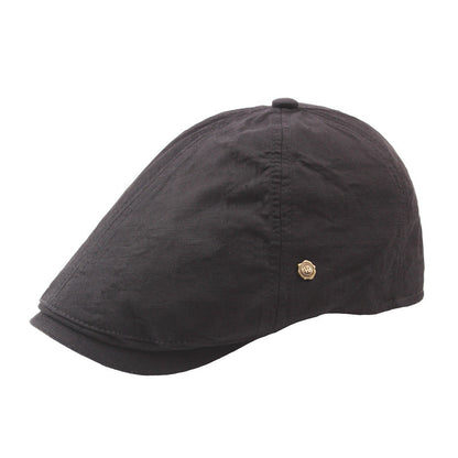 Plaid men's flat cap retro beret with copper button detail, close-up view