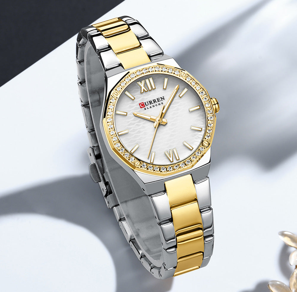 Women's small dial Roman numeral casual watch with a minimalist round face and slim strap