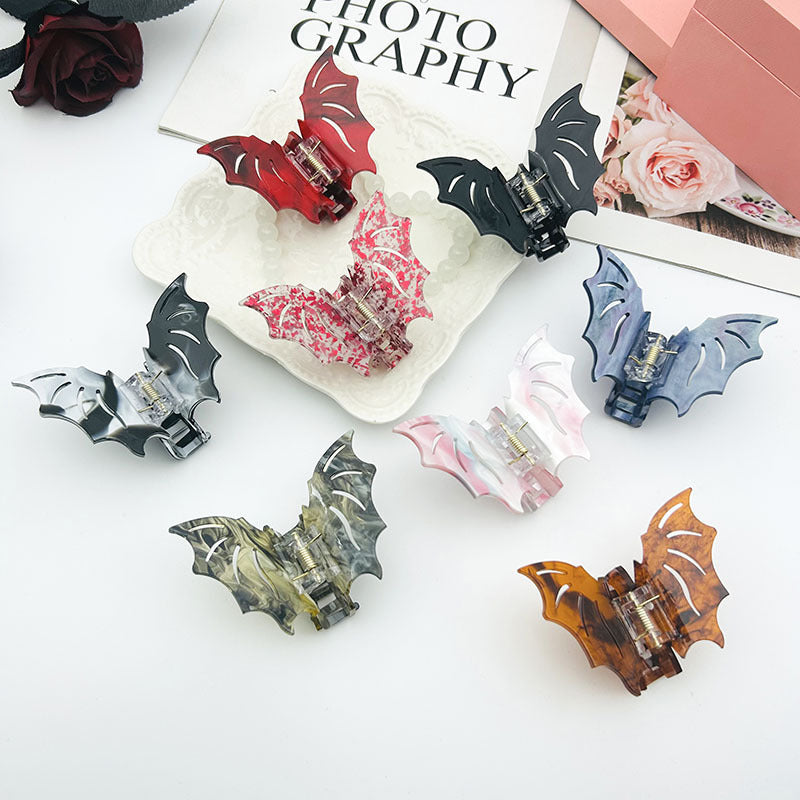 Halloween bat barrettes for girls, featuring playful bat designs for securing hair