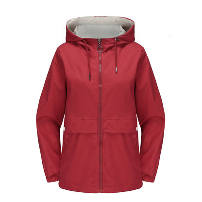 Women's hooded solid color trench coat in a classic longline style