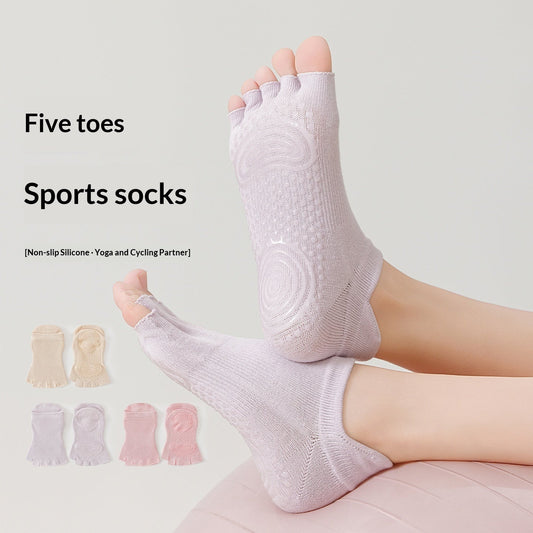 Open-toe five-finger yoga socks for women in black, featuring a flexible design for barefoot-style movement
