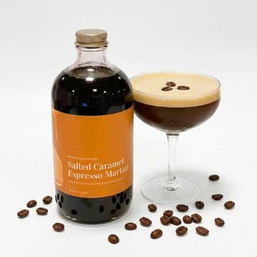 Wood Stove Kitchen salted caramel espresso martini mixer in a 16oz bottle, showing the rich caramel and coffee drink mix.