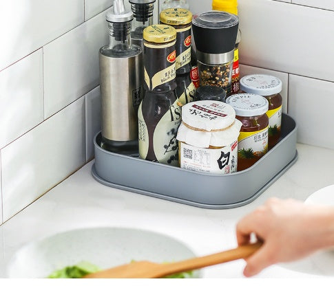 Multifunctional rotating shelving condiment storage box with tiered shelves and organized compartments