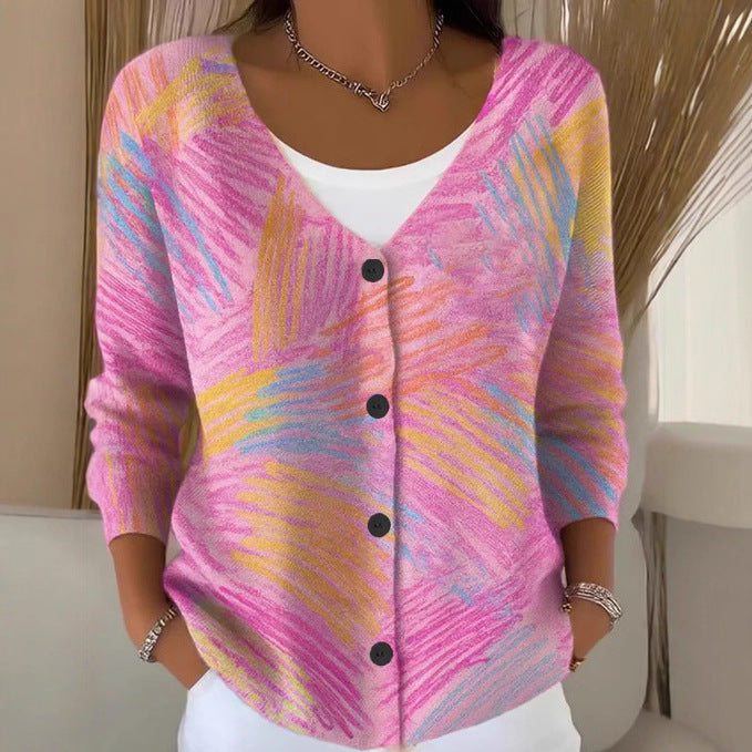 Women's printed knitted sweater cardigan with buttons, showing patterned fabric and long sleeves