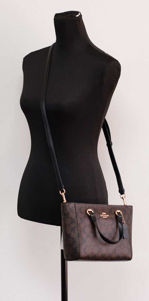 Coach Alice small brown and black crossgrain leather satchel crossbody bag with convertible strap and sleek design.