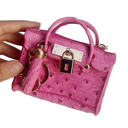 Leather solid color fashion tassel mini handbag with compact design and detachable shoulder strap
