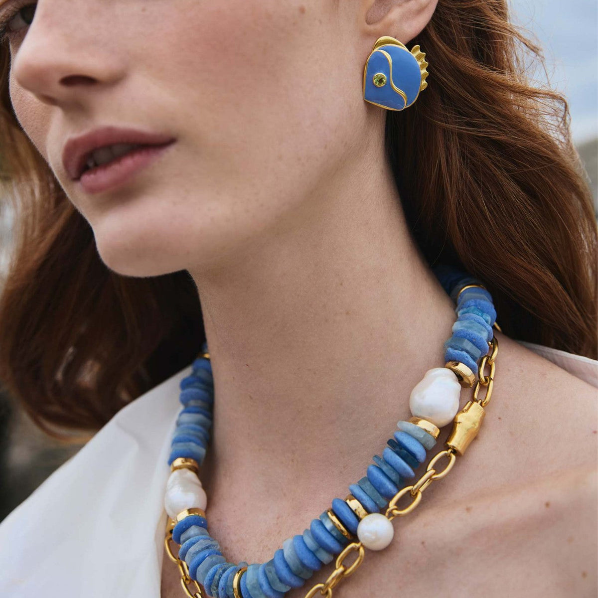 Retro chic blue little fish earrings with playful fish-shaped design