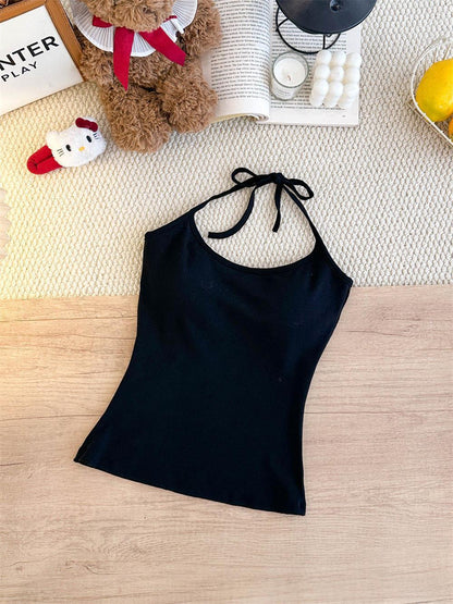 Women's figure-flattering off-shoulder halter strap dress on a model