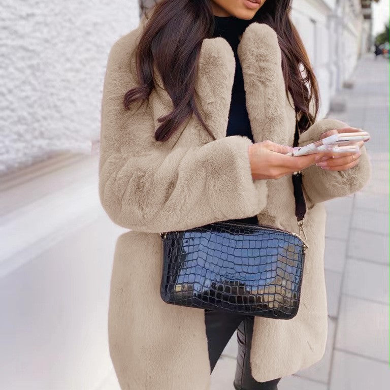 Women's solid color long sleeve lapel faux fur coat with a soft, elegant design