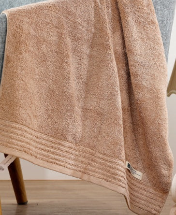 Cotton towel set in soft, absorbent fabric, neatly folded for a clean, simple presentation