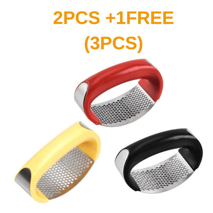 Stainless steel manual garlic press with curved design for mashing garlic and vegetables in the kitchen
