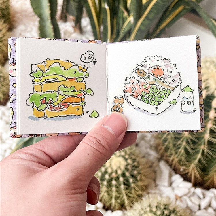 Fabric watercolor notebook for art students, square portable painting sketchbook close-up