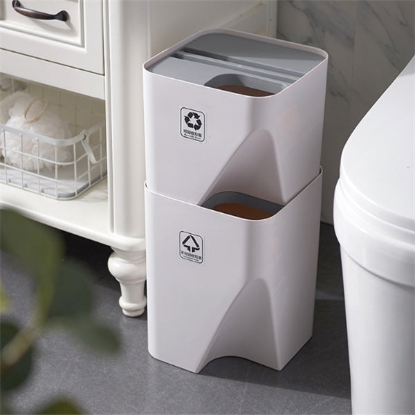 Stacked kitchen trash can recycle bin with separate dry and wet waste compartments beside bathroom wall