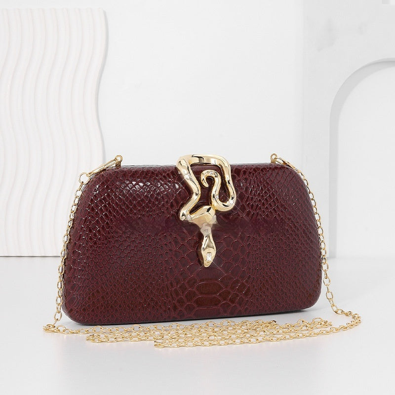 Women's stylish snake-print evening tote with sophisticated European-American design