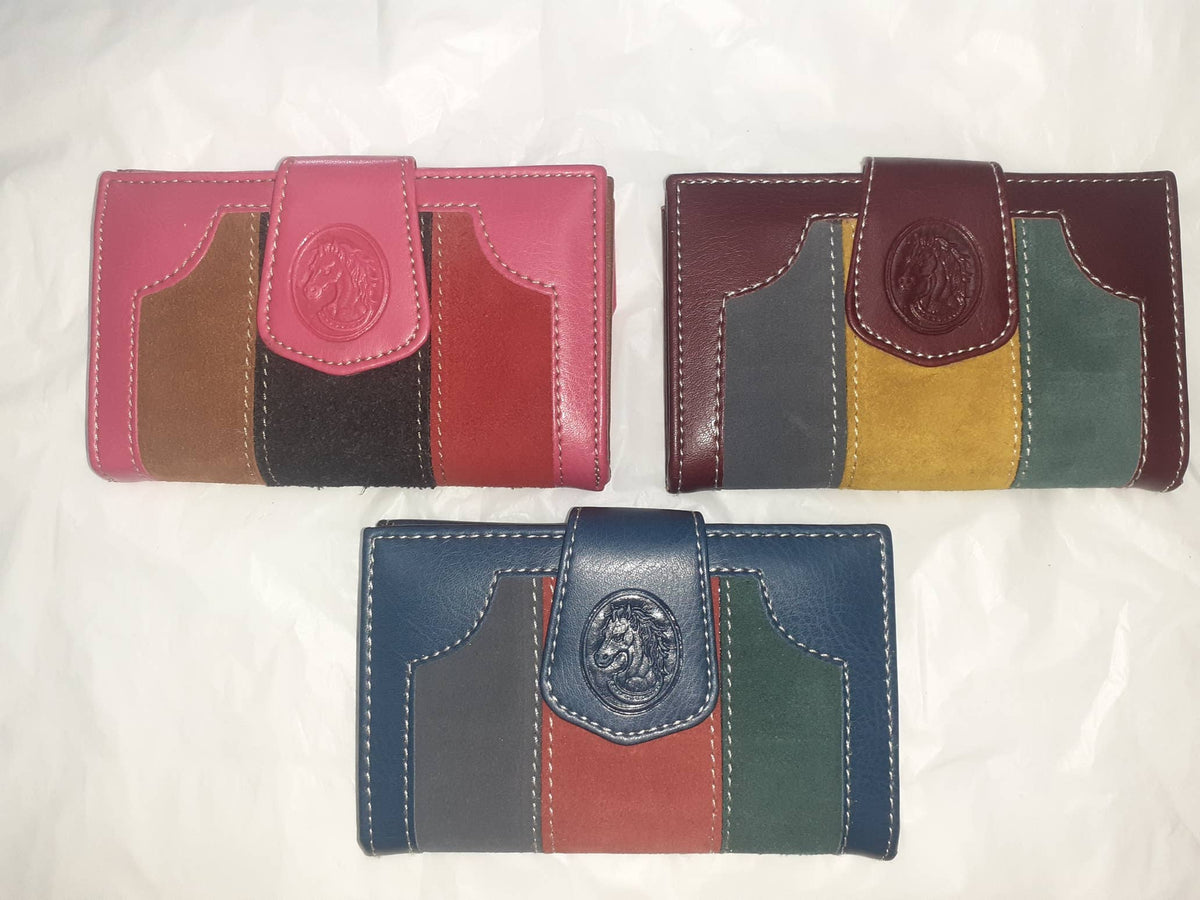 Handmade women's wallet with multiple card slots and a sleek design, crafted by Hecho a mano in genuine leather.