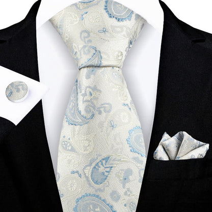 Jacquard-embroidered cashew flower tie with detailed floral pattern and textured fabric
