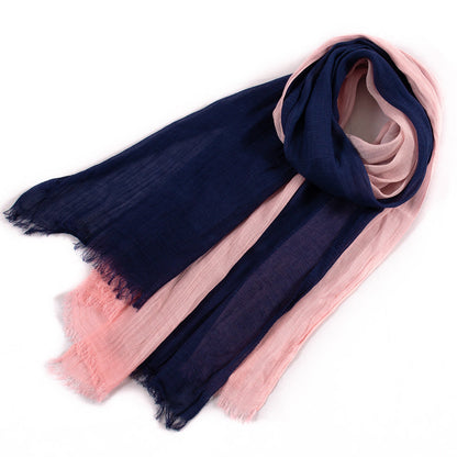 Large soft warm cotton tassel scarf folded flat with textured fabric and fringed edges