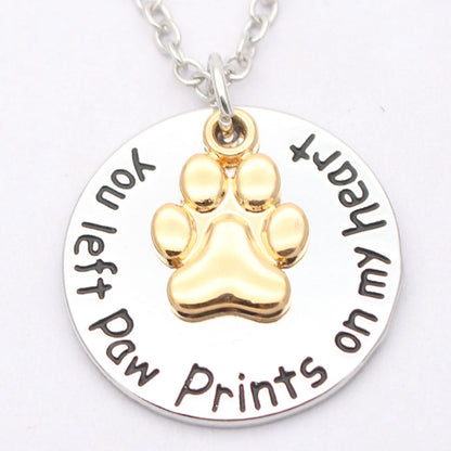 Dog paw necklace by My Store featuring a delicate paw pendant on a chain