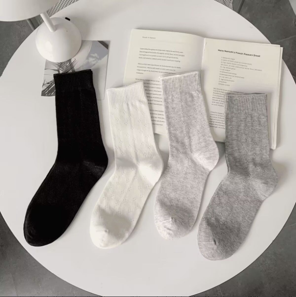 White curled and hollowed-out socks, 1 pair