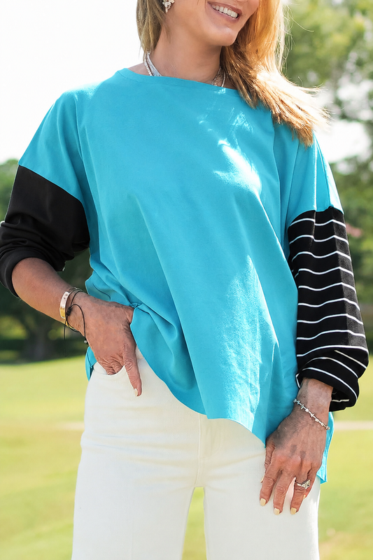 Model wearing a PLANET by Lauren G Pima Cotton Mixed Media Boxy T-Shirt in Capri color, showcasing casual relaxed fit.