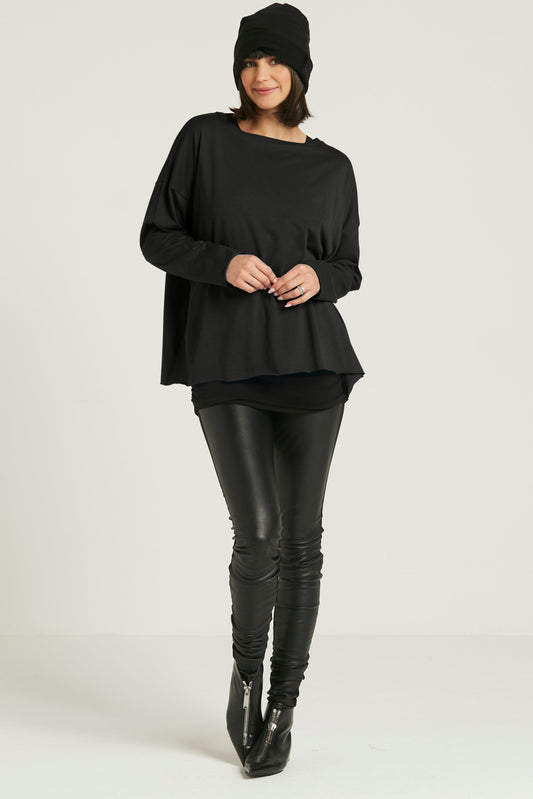 Black Pima cotton luxury boxy T-shirt by PLANET by Lauren G displayed on a hanger.