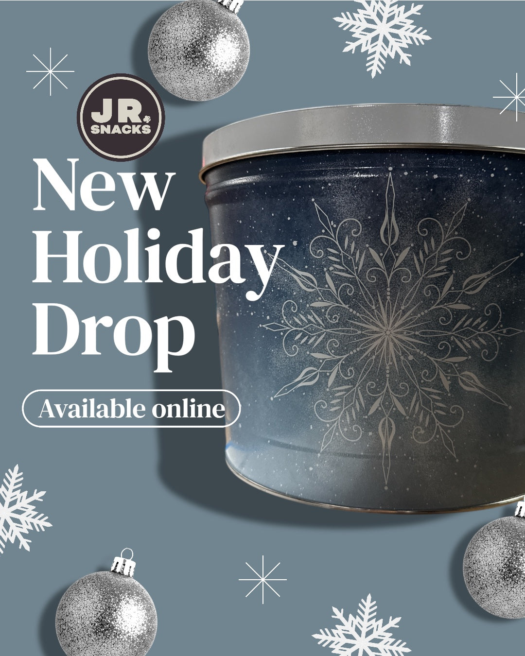 Junior Snacks Company holiday 2-gallon tin filled with assorted snack treats, festive packaging for the holiday season.
