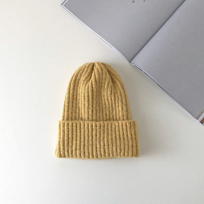 Warm knitted hat from My Store in soft textured fabric.